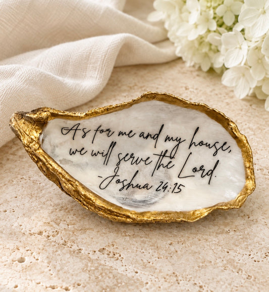 Gold-edged Joshua 24:15 oyster staged with ivory linen and white hydrangeas
