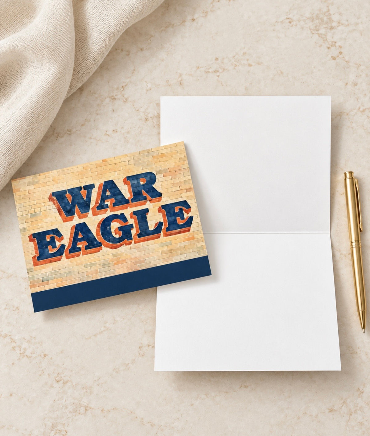 War Eagle folded stationery card with navy and orange lettering on a brick design and a blank interior