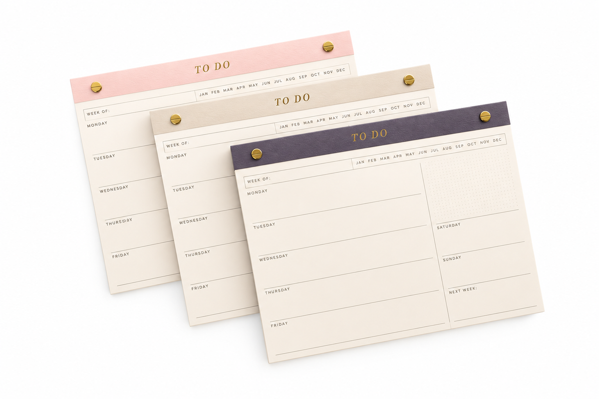 Weekly desk pads with gold binding posts